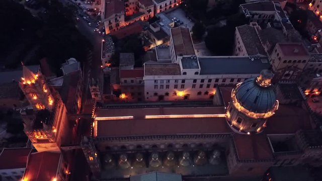drone flying over Palermo Cathedral with beautiful night lights, Sicily, Italy. Built in arab-norman style, it is a UNESCO World Heritage Site