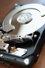 open hard disk pc with surface and electronic parts visible. hardware computer