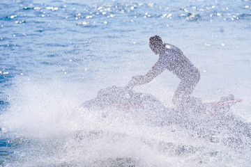 Naklejka premium silhouette of jet boat driving in the water wave