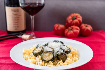 Italian food: pasta with zucchini and parmesan