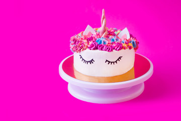 cake a unicorn on a pink background