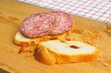 typical traditional Italian salami with bread and suppressed for a snack with healthy food