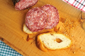 typical traditional Italian salami with bread and suppressed for a snack with healthy food