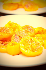 slices of baked potatoes on a white plate