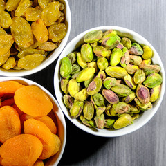 Selection Of Healthy Natural Snacks In White Bowls