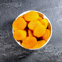 Bowl of Soft Apricots In A White Bowl