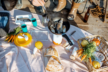 Beautiful picnic with fresh caught fish and vegetables