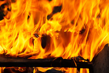 Old wooden piece of furniture on fire, burning old things