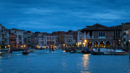 Panorama of Venice at night; Italy. Evening view of Grand Canal and tourist boats; main street of...