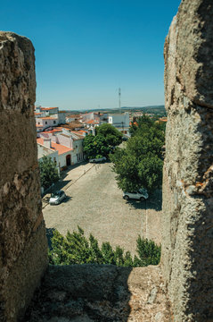 Old houses and street seen from crenel in the wall of Elvas Castle