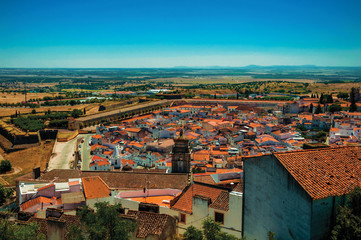 Fototapeta na wymiar House rooftops and old city wall seen from the Castle of Elvas