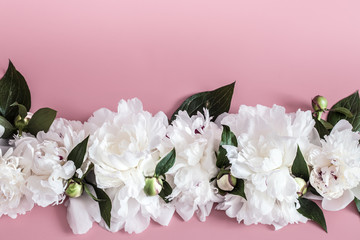 Design concept - top view of bunch of beautiful flowers on colored background with copy space