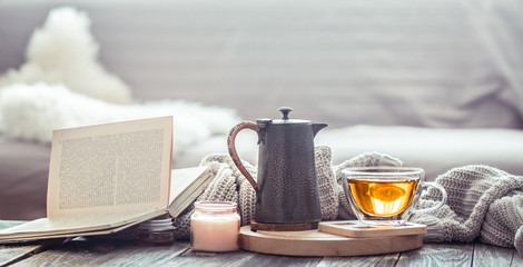 Cozy autumn still life with a cup of tea