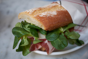 Sandwich with coppa and baby lettuce