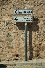 Street signpost indicating public services and city attractions