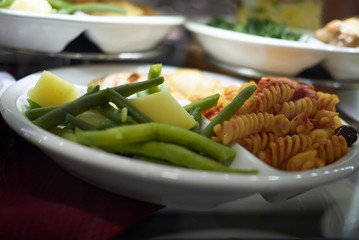 Vegetarian plate with pasta and boiled vegetables