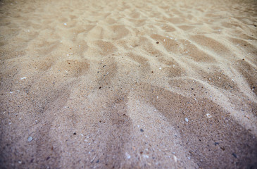 Fine beach sand in the summer sun