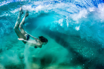 Fototapeta na wymiar Diving wave underwater