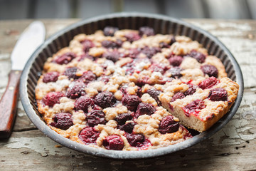Cherry pie with crumble in vintage form 