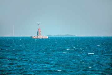 lighthouse in the blue sea water