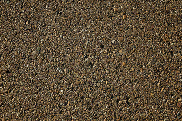 Close-up of asphalt with gravel inserted in it