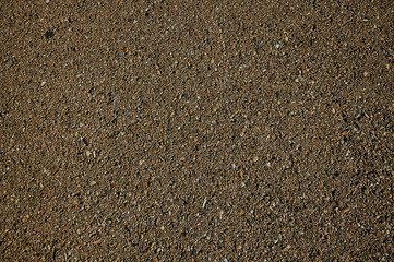 Close-up of asphalt with gravel inserted in it