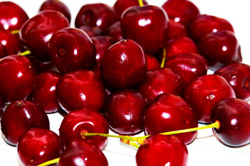 Fresh cherry on wooden white background. Fresh ripe cherries. Sweet cherries. Macro