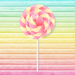 Round candy on a background of colored boards