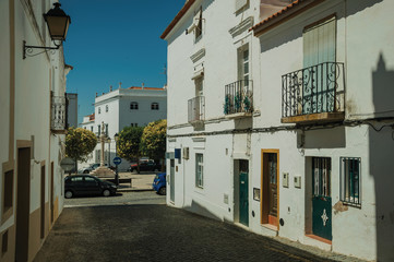 Fototapeta na wymiar Alley with old houses and deserted causeway