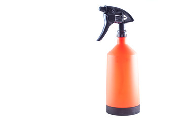 Spray the garden for care of plants. Bright orange capacity. On a white background, isolate.