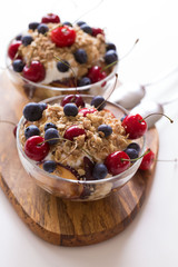 Food. Fruit salad with cherries, blueberry, muesli, yogurt
