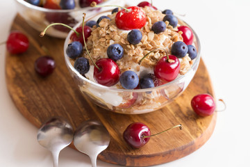 Food. Fruit salad with cherries, blueberry, muesli, yogurt