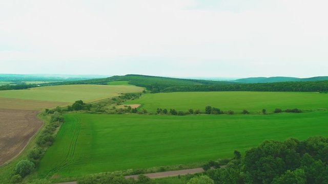 Aerial view of landscape. Top view of beautiful green hills. Copy space. 4K.