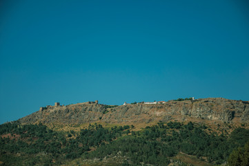 Fototapeta na wymiar Marvao village on top of tall crag with stone walls and towers