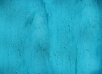 Obraz premium abstract turquoise painted wall. Texture of old rustic wall covered with blue-turquoise paint. background texture surface background. grunge turquoise painted wall template 