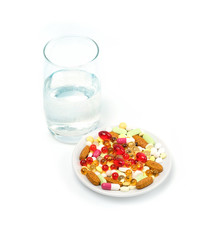 glass of water and Medicine pills, capsules on white background. Drug prescription, treatment medication concept. Pharmaceutical medicament, health care, treatment of diseases. copy space