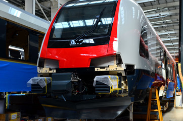 Inside of the rail car assembly plant. Industrial workshop for the production of European high speed trains. Factory of the manufacturing trainsets rolling stock Stadler