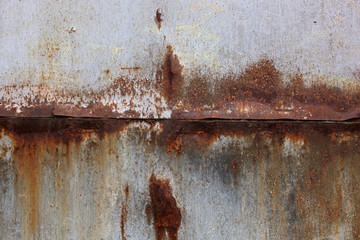 Bright rust stains texture paint showing through to rust underneath