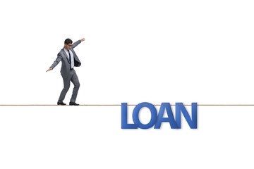 Debt and loan concept with businessman walking on tight rope