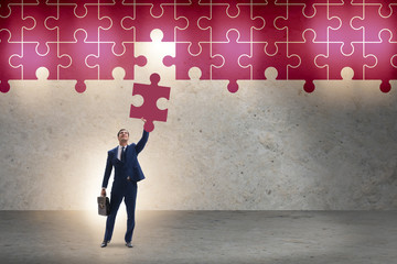 Concept of businessman with missing jigsaw puzzle piece