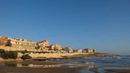 Fototapeta na wymiar Cava D'aliga, Province of Ragusa, Sicily. Cava D'aliga is a small seaside town in southeast of Sicily, with beautiful beaches. The life and pace changes completely depending on the season.