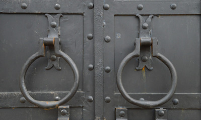 ring handles on the iron door
