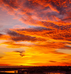 fiery dramatic orange cloud sunset over Catalina Island in California