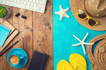 Summer holiday vacation concept with beach accessories and office desk background. Top view from...