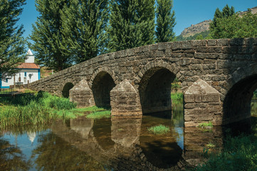 Fototapeta na wymiar Old Roman stone bridge over the Sever River in Portagem