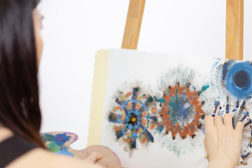 Artist painting on an easel