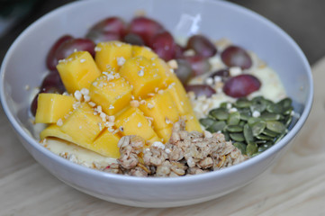 smoothie bowl, mango yogurt with fruit topping