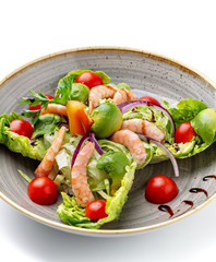 Dietary salad of avocado shrimp tomato and seasonings.