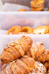 Almond croissant for sale at an outdoor market