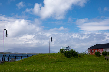 Blue sky,white cloud and Ms Trollfjord arrive Brønnøysund port	